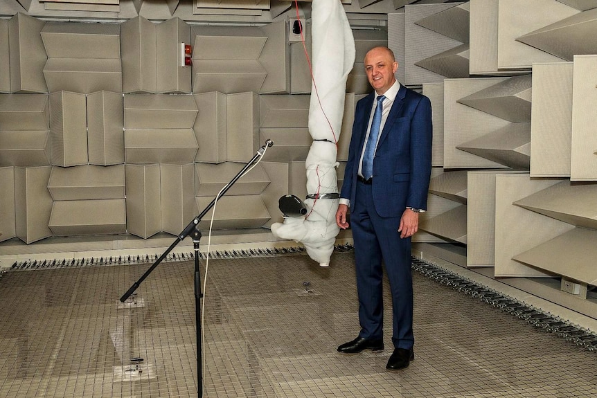 Mike Burges in a room with wire floor and acoustic padding.