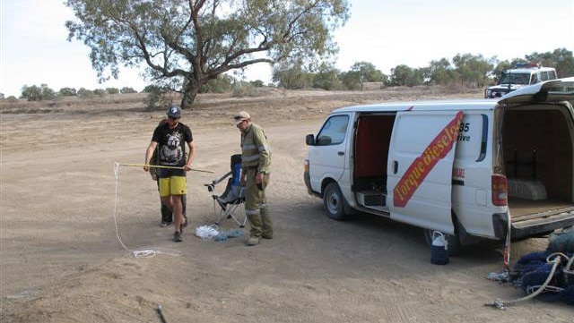 A licensed crocodile catcher sets up near Birdsville to capture a 1.5 metre freshwater croc in the Diamantina River.