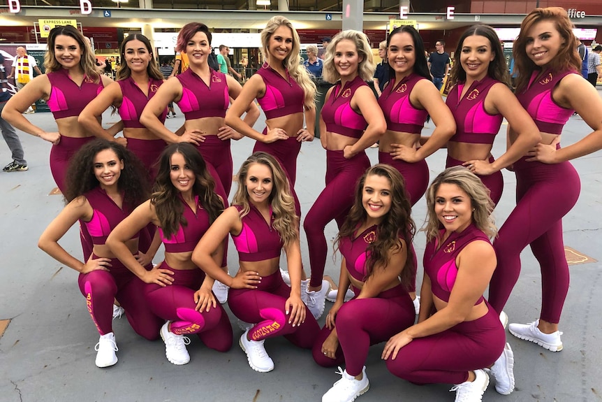 The Brisbane Broncos dance squad in maroon and pink tights and sports bras.