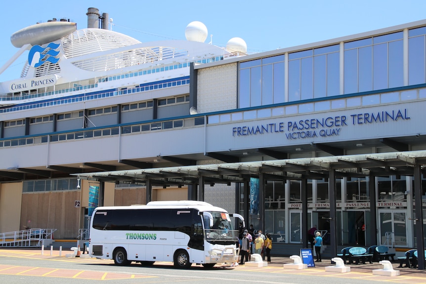 A bus parked in front of the Fremantle Passenger Terminal.
