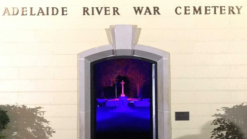 The front of Adelaide River War Cemetery with the cenotaph visible through the doorway.