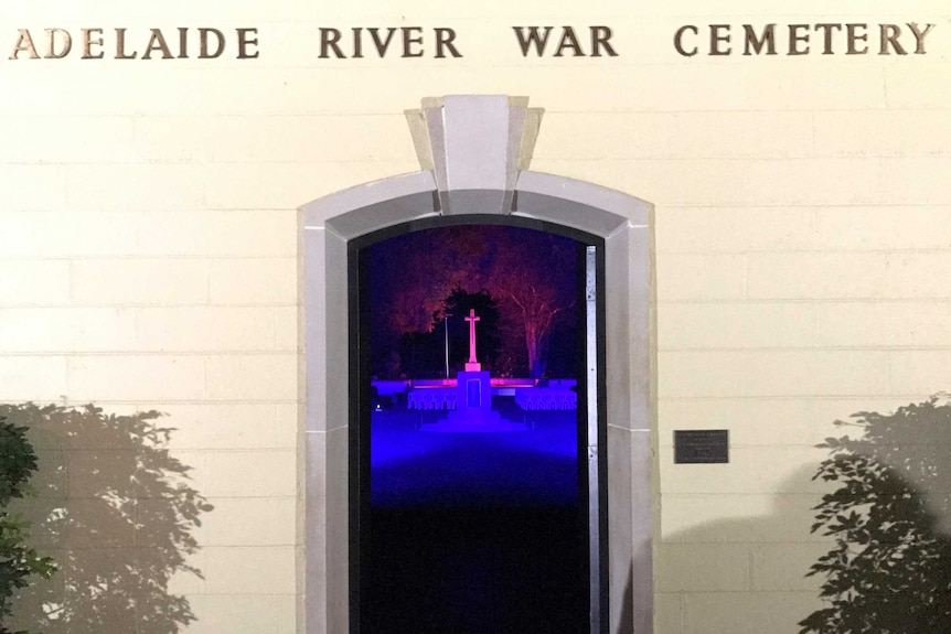 The front of Adelaide River War Cemetery with the cenotaph visible through the doorway.
