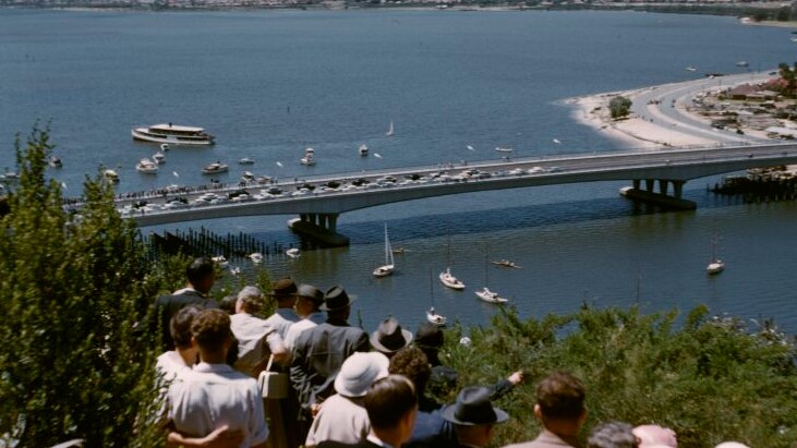 People watch the official opening of the Narrows Bridge from Kings Park