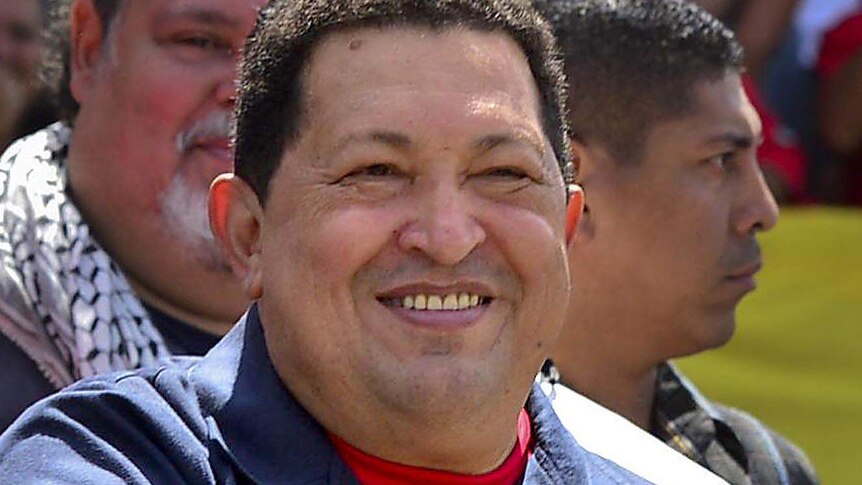 Hugo Chavez gestures before voting.