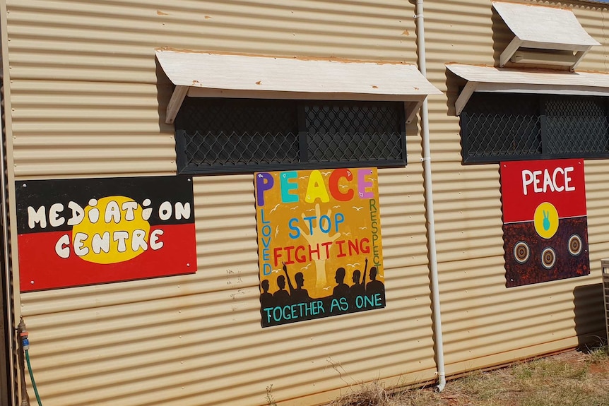 A building with peace posters on it.