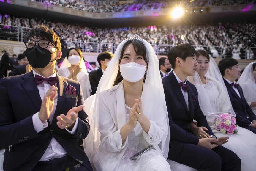 Thousands of couples attend a mass wedding in South Korea