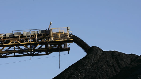 Coal stacker pours coal into piles