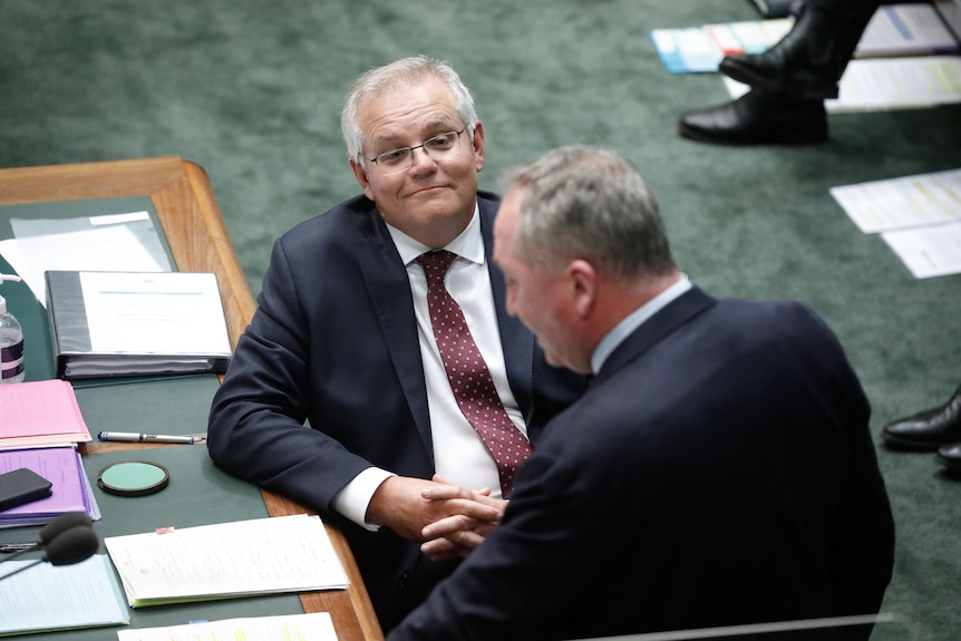 Scott Morrison watches Barnaby Joyce as he speaks in the House of Representatives
