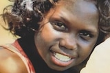 A portrait of Gabby Wanambi smiling.