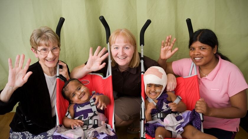 Twins Krishna (L) and Trishna (R) left the hospital in separate strollers.