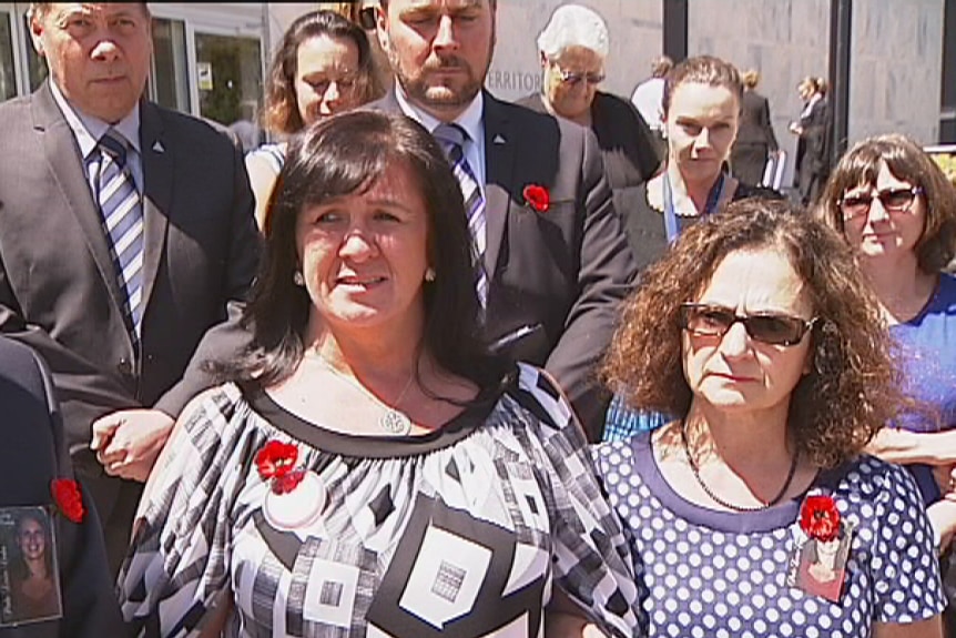 Sharon Bell (left) is flanked by supporters outside the ACT Supreme Court as she speaks about the sentencing of her daughter's murder.