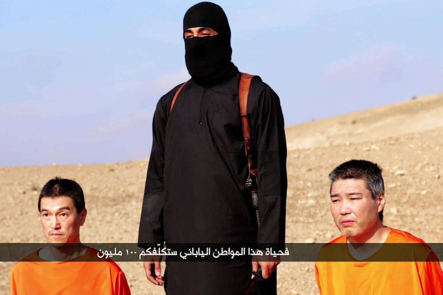 An image grab of Japanese hostages Kenji Goto and Haruna Yukawa