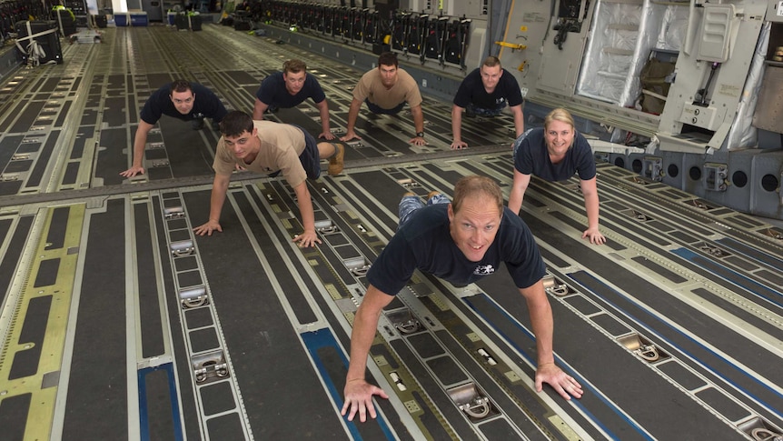 Air Force personnel doing push-ups to raise awareness of veteran suicide