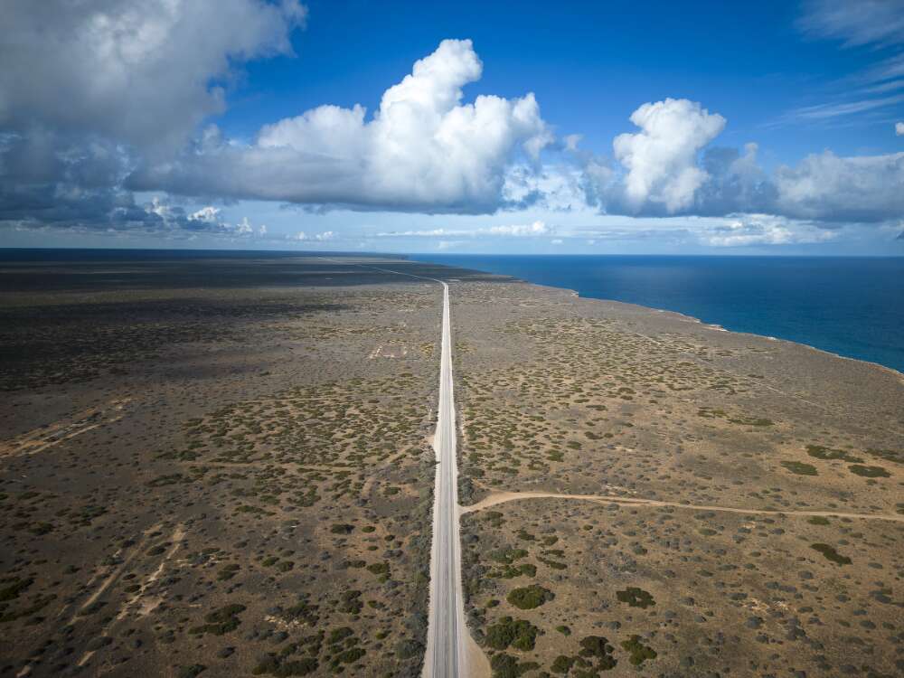 An aerial view of the Eyre Highway looking east across the Nullarbor Plain in South Australia.