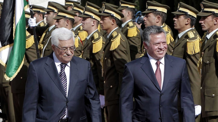 Mahmoud Abbas and King Abdullah II review an honour guard upon the King's arrival in the West Bank.