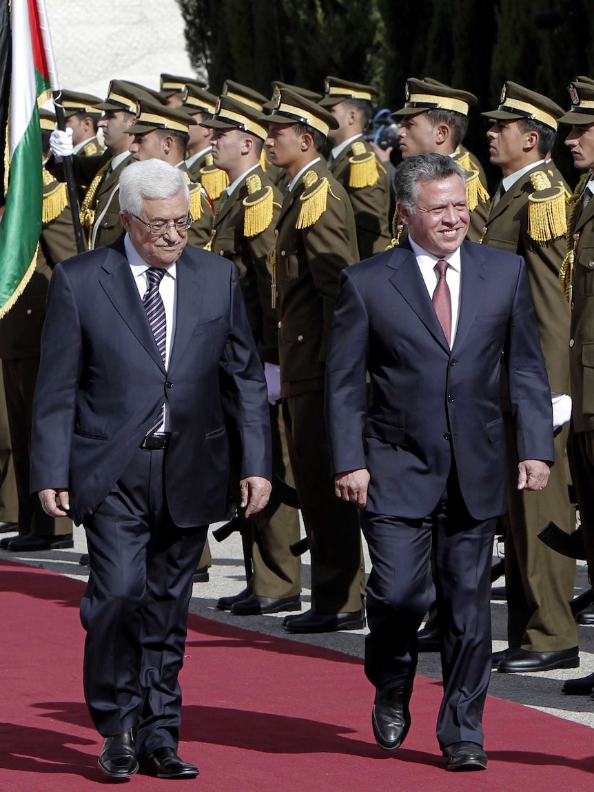 King Abdullah (right) was given a guard of honour as he arrived to meet with Mahmoud Abbas (left).