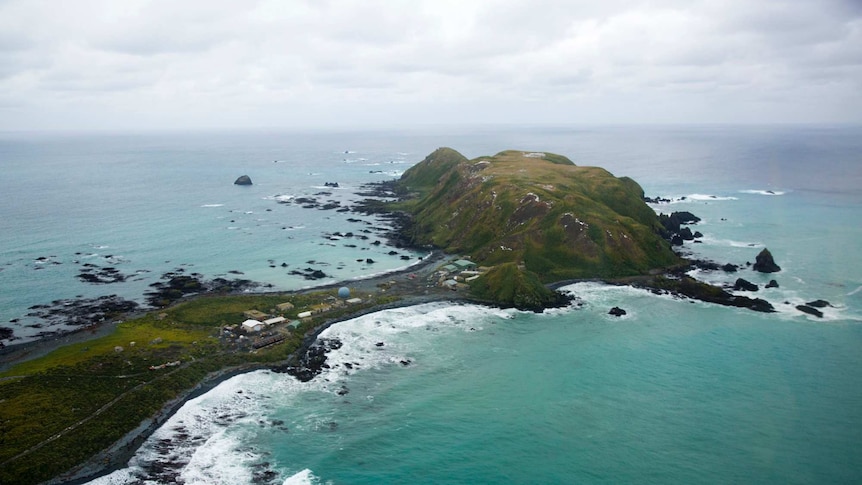 A birds eye view of the buildings on the narrow neck of an island.