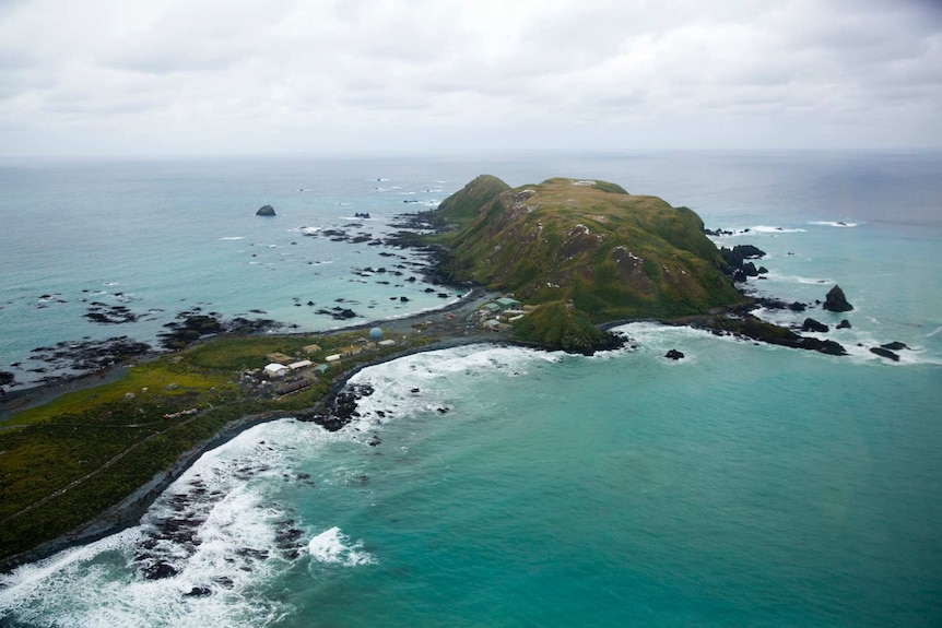 A birds eye view of the buildings on the narrow neck of an island.