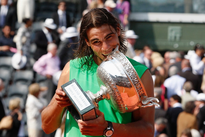 Rafael Nadal chows down on the French Open trophy