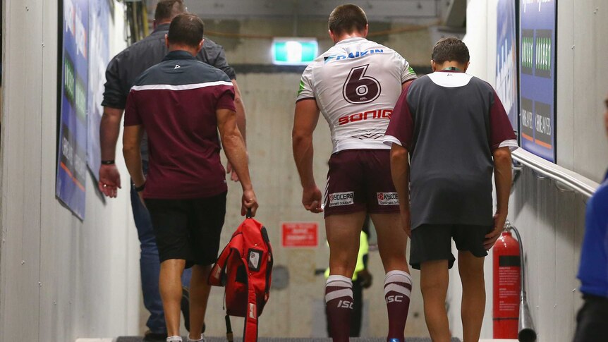 Manly's Kieran Foran walks up the tunnel after coming off injured against Parramatta.