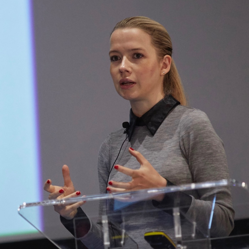 A woman delivers a speech. 