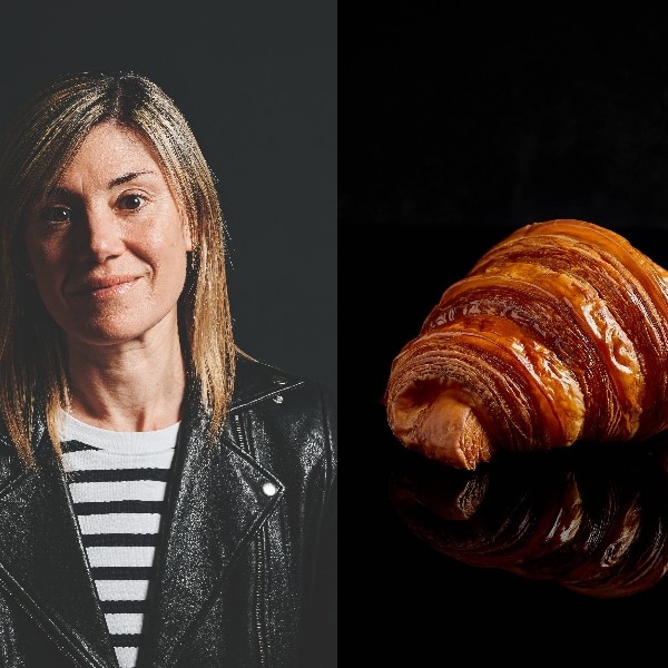 A portrait of a woman with blond hair is paired with a golden croissant central on a black background.