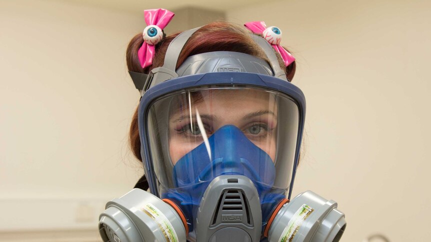 A close up of Hannah Lewis wearing protective breathing apparatus.