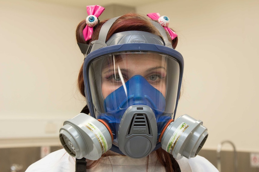 A close up of Hannah Lewis wearing protective breathing apparatus.