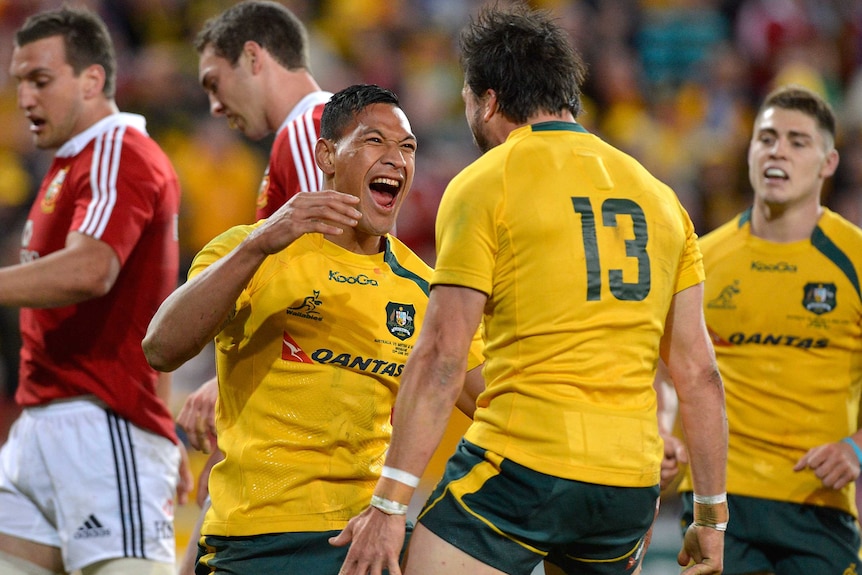 Wallabies debutant Israel Folau celebrates scoring the opening try against the Lions at Lang Park.