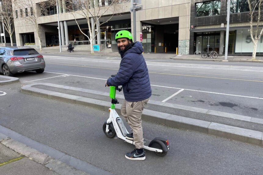 Annas Davids is pictured on a scooter wearing a helmet and jacket.