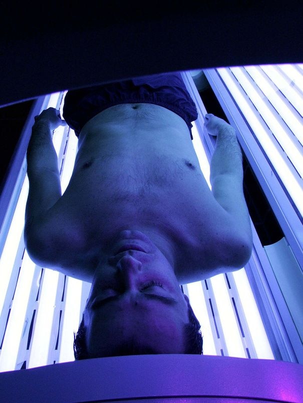 a man enjoying a session in a sunbed