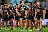 The Rabbitohs show their dejection during the narrow loss to the Broncos.