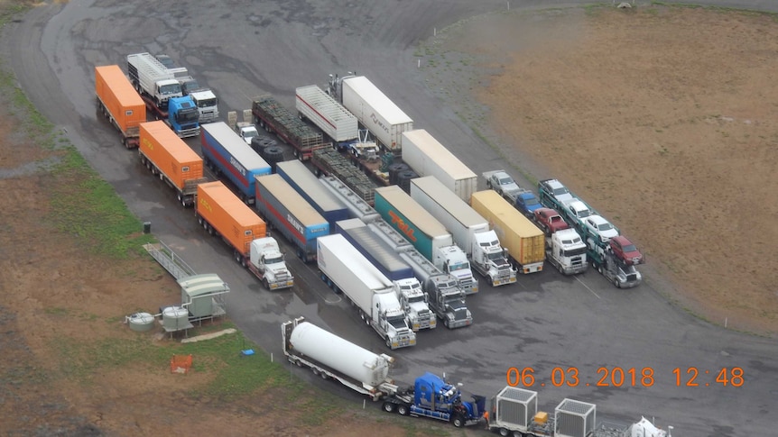 Trucks stopped at McKinlay due to floodwaters