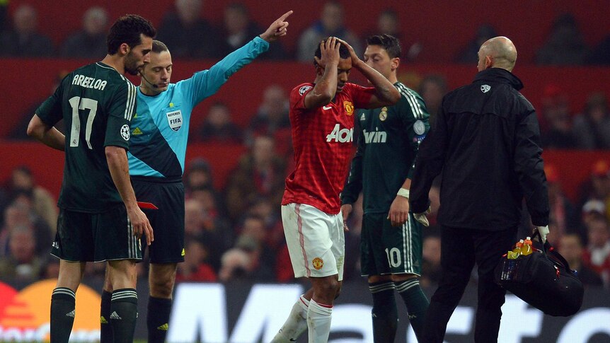 Game-changer ...  Nani is sent off by Turkish referee Cuneyt Cakır after his challenge on Alvaro Arbeloa (L).