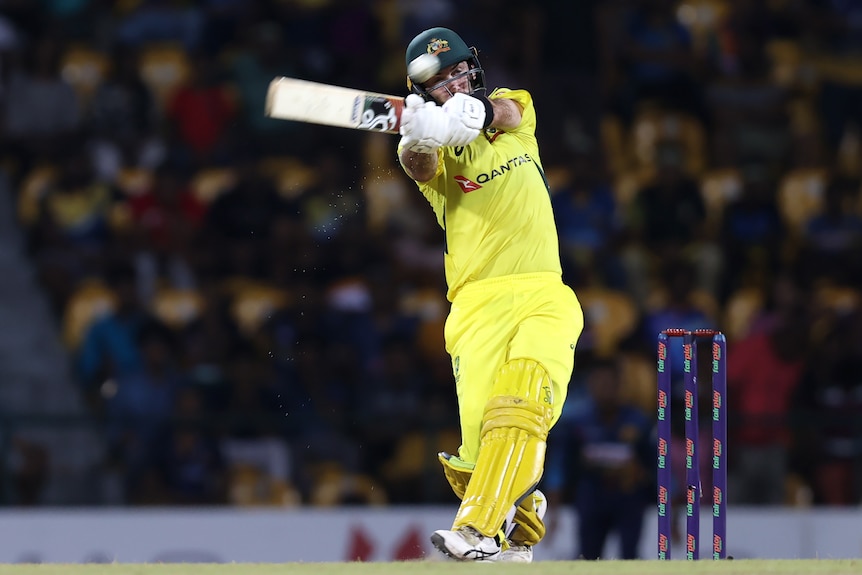 Glenn Maxwell swings his bat across to hook a ball to the boundary for Australia in a limited overs match.