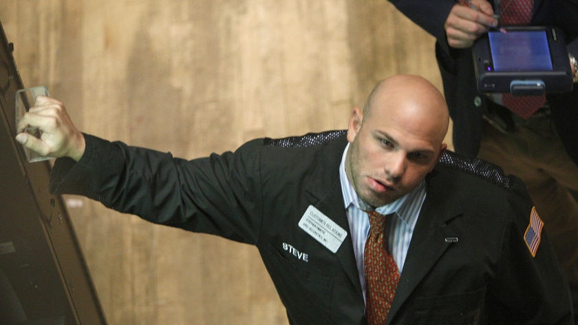 A trader takes a break at the New York Stock Exchange,