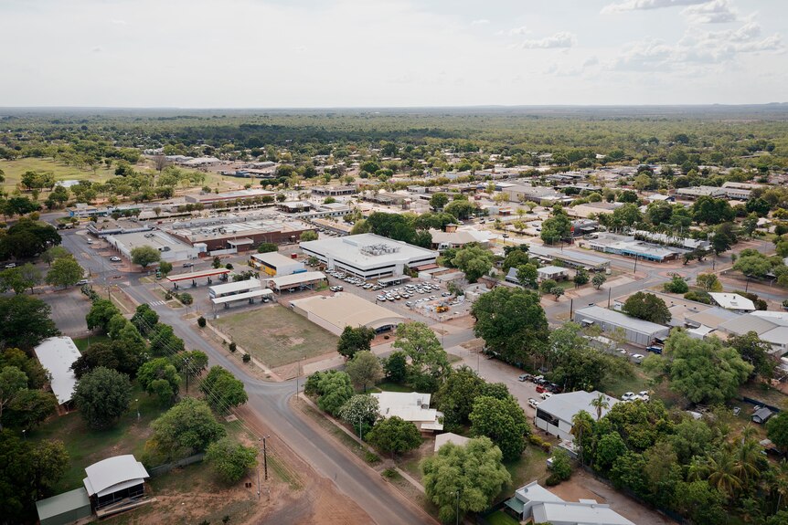 An aerial view of the town of Katherine, showing the main street and the roofs of businesses and houses.