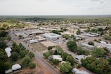 An aerial view of the town of Katherine, showing the main street and the roofs of businesses and houses.