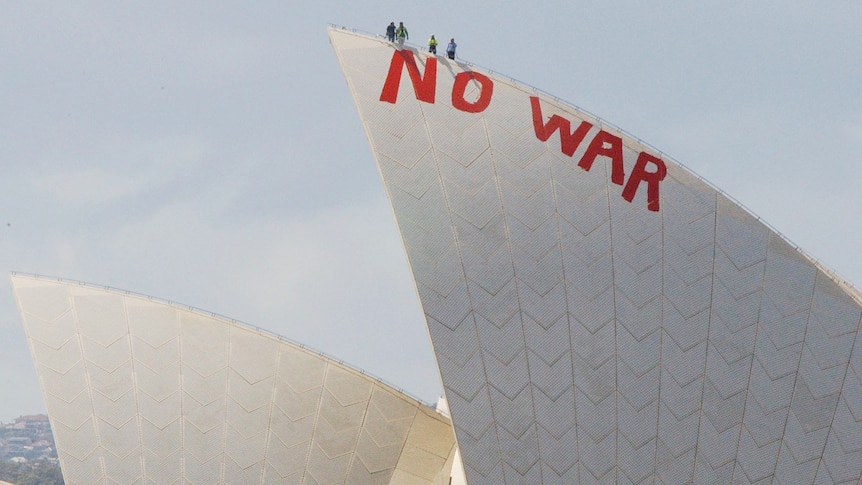 NO WAR in red paint written on one of the sails of the Sydney Opera House.