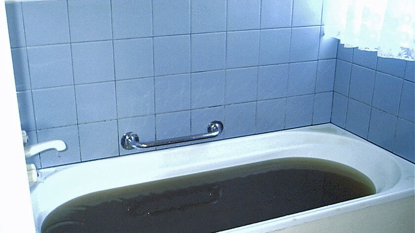 Muddy water in a bath in Campbell Town Tasmania