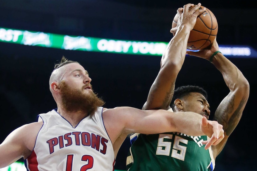 Aron Baynes fights for a rebound in the NBA preseason