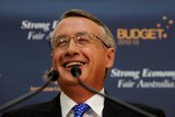 Wayne Swan smiles during lock-up