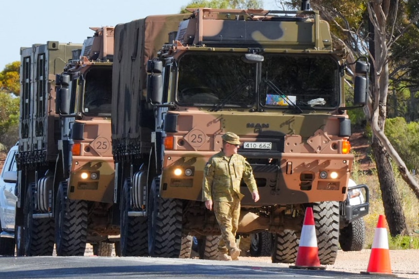 A convoy of Australian Defence Force trucks.