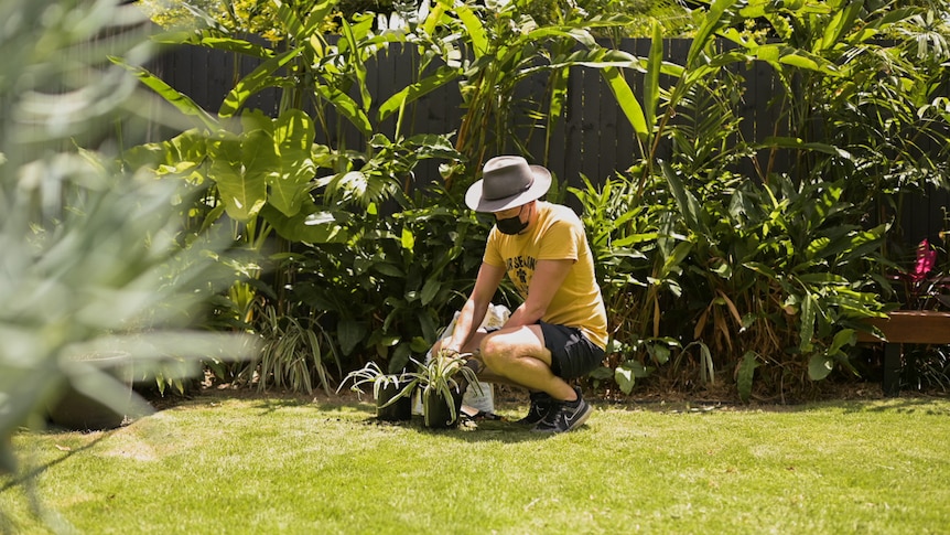 Man gardening with pot plants