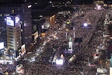 Thousands of people occupy centre of Seoul at night in a protest against Park Geun-hye.