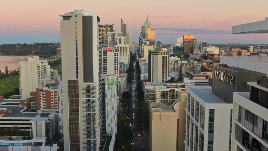 A drone shot of a sunrise over Perth, looking down the main street