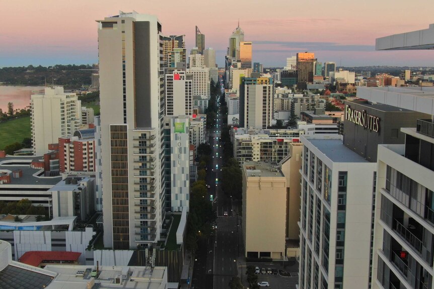 A drone shot of a sunrise over Perth, looking down the main street
