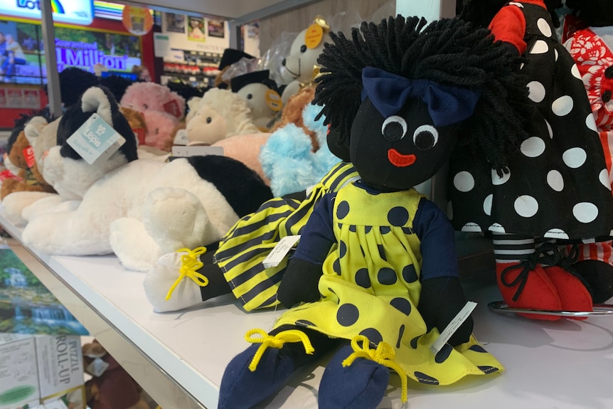 Female gollywog doll on the shelf at a newsagency 