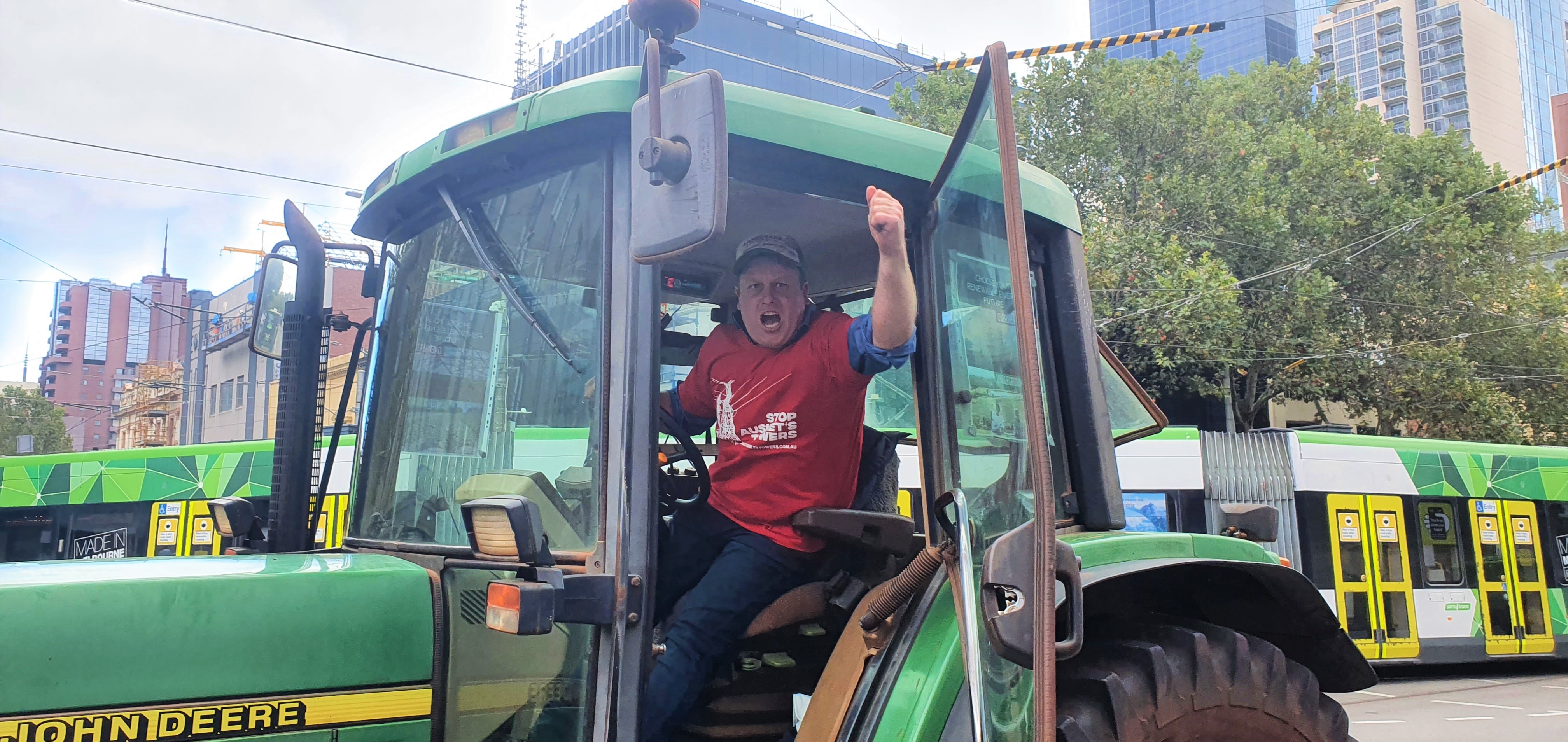 An angry farmer in tractor protesting at Parliament House in Melbourne.