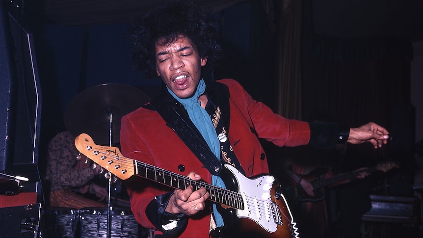 Jimi Hendrix playing guitar